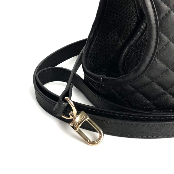 Black step-in dog harness with padded chest panel